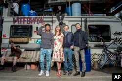 In this March 16, 2018 photo, Tye Sheridan, from right, Steven Spielberg, Oliva Cooke, and Lena Waithe pose for a portrait at the interactive "Ready Player One" pop-up on Hollywood and Vine in Los Angeles.