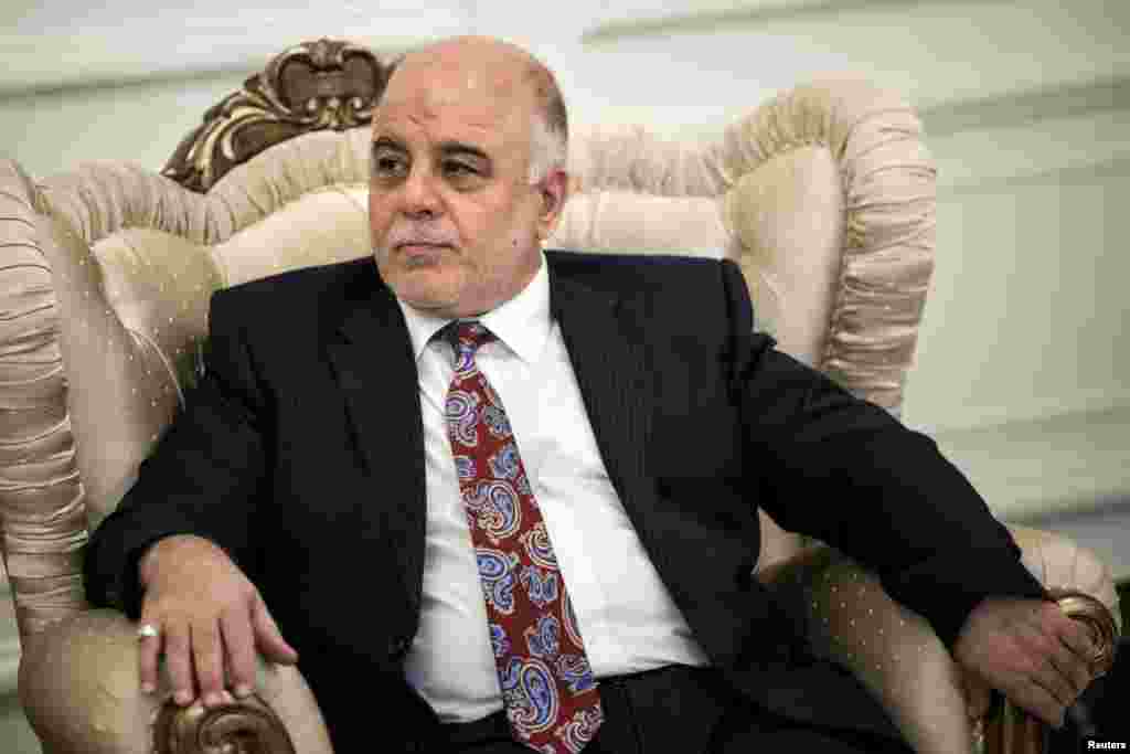 New Iraqi Prime Minister Haider Abadi listens to U.S. Secretary of State John Kerry, unseen, during a meeting in Baghdad, Sept. 10, 2014.