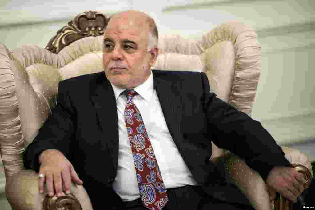 New Iraqi Prime Minister Haider Abadi listens to U.S. Secretary of State John Kerry, unseen, during a meeting in Baghdad, Sept. 10, 2014. 