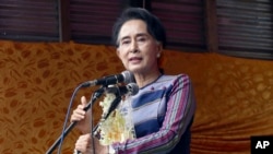 Myanmar opposition leader Aung San Suu Kyi speaks during her “Election Awareness Tour” in Ho-Pong township in Pa-O self-administrative zone, southern Shan State, Myanmar, Sunday, Sept. 6 2015.