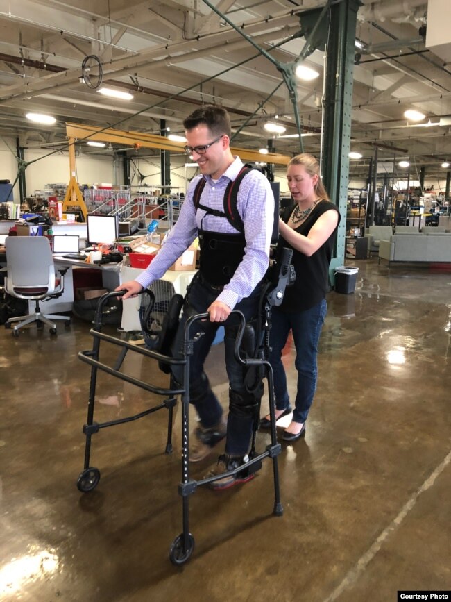 Patrick Wensing tests out an Ekso Bionics exoskeleton in his lab at the University of Notre Dame. He and his team are working to make the machines more intuitive. (Photo: Notre Dame)