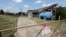 A gate at the U.S. Oil Recovery Superfund site, Sept. 14, 2017, in Pasadena, Texas, where three tanks once used to store toxic waste were flooded during Hurricane Harvey.