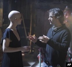 DELPHINE CHANEAC as Dren and director VINCENZO NATALI on the set of Warner Bros. Pictures’ and Dark Castle Entertainment’s science fiction thriller “SPLICE,” a Warner Bros. Pictures release.