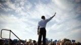 President Barack Obama waves to supporters during a campaign event at McArthur High School, Hollywood, Florida, November 4, 2012.