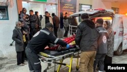 FILE—A Palestinian wounded in an Israeli strike is rushed into a hospital, amid the ongoing conflict between Israel and the Palestinian Islamist group Hamas, in Rafah, in the southern Gaza Strip, February 12, 2024.