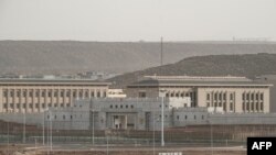 FILE - Buildings on a Chinese military base are seen next to Doraleh Multi-Purpose Port in Djibouti, July 4, 2018.