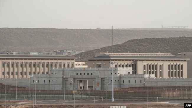 FILE - Buildings on a Chinese military base are seen next to Doraleh Multi-Purpose Port in Djibouti, July 4, 2018.