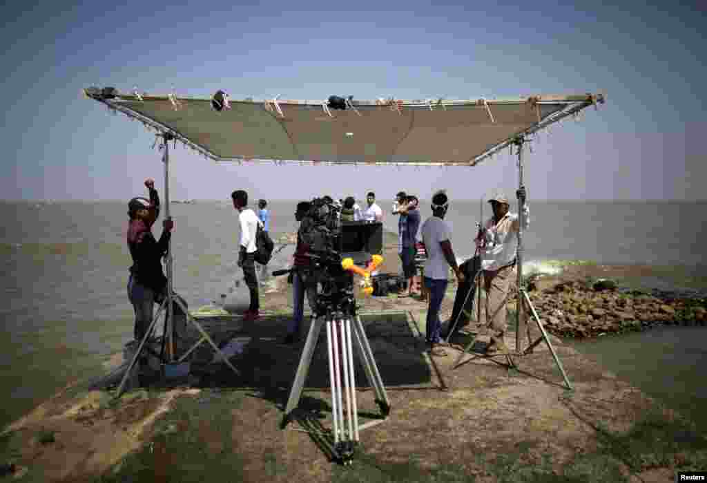 A film camera is garlanded with flowers after a prayer ceremony before the start of the shoot for Bollywood film 'Black Home' on the outskirts of Mumbai, April 26, 2013.