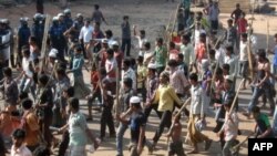 Jamaat-e-Islami activists march in Chittagong, Bangladesh, March 2, 2013, to protest war crimes' conviction of one of their leaders.