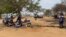 Patients wait for service outside Chesa Rural Clinic in Mount Darwin district, about 200 km north of Harare, Nov. 04, 2021. The government is opening more such clinics to help people with conditions like diabetes. (Columbus Mavhunga/VOA)