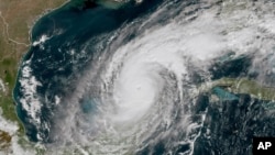 This GOES-16 GeoColor satellite image taken at 12:15 p.m. EDT and provided by the National Oceanic and Atmospheric Administration shows Hurricane Milton in the Gulf of Mexico, off the coast of Mexico’s Yucatan Peninsula on Oct. 8, 2024. (NOAA via AP)