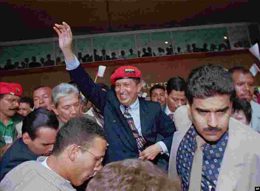 Chavez waves to the crowd after announcing his candidacy for the presidency in downtown Caracas Plaza, Venezuela, July 29, 1997. 