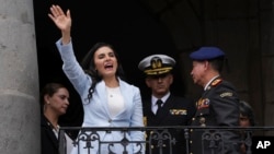 FILE - Ecuadoran Vice President Veronica Abad waves to a crowd from a balcony of the Carondelet government palace, in Quito, Ecuador, on Nov. 28, 2023. Abad was suspended on Nov. 9, 2024, for 150 days after being accused of "abandonment" of her duties.