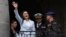 FILE - Ecuadoran Vice President Veronica Abad waves to a crowd from a balcony of the Carondelet government palace, in Quito, Ecuador, on Nov. 28, 2023. Abad was suspended on Nov. 9, 2024, for 150 days after being accused of "abandonment" of her duties.