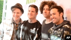 From left to right, singer Patrick Stump, drummer Andy Hurley, musician Joe Trohman, and musician Pete Wentz of the rock band Fall Out Boy arrive at Wango Tango 2013 at The Home Depot Center on May 11, 2013 in Carson, Calif.