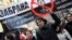 FILE - Protesters shout slogans and carry a banner that reads "Ban shale gas tests through hydraulic fracturing" during a rally in central Sofia, January 14, 2012. 
