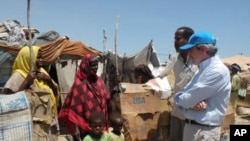UN Deputy High Commissioner for Refugees, T. Alexander Aleinikoff, talks to internally displaced people at a camp in Bossaso, a city in the northern state of Puntland, Somalia (file photo)