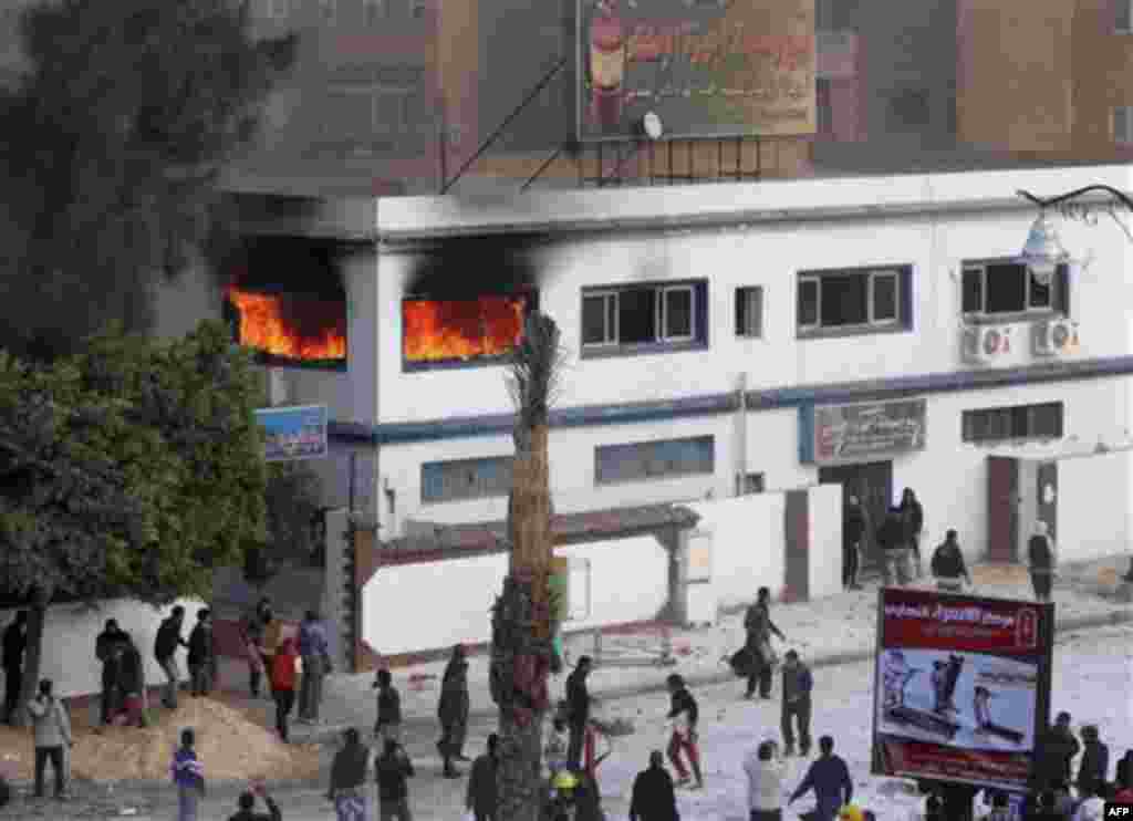 A fire station seen burning during clashes between protestors and anti-riot policemen in Suez, Egypt, Thursday, Jan. 27, 2011. Egyptian activists protested for a third day as social networking sites called for a mass rally in the capital Cairo after Frida