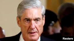 FILE - Special Counsel Robert Mueller departs after briefing members of the U.S. Senate on his investigation into potential collusion between Russia and the Trump campaign on Capitol Hill in Washington, U.S.