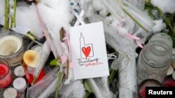 A drawing representing Strasbourg's cathedral is seen at an improvised memorial in tribute to the victims of December 11 attack during a ceremony in Strasbourg, France, Dec. 16, 2018. The sign reads "Strasbourg my love." 