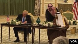  O presidente americano e o rei saudita assinam os acordos