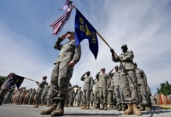 FILE - U.S. soldiers take part in a change-of-command ceremony at the Manas airbase that has supported U.S. military operations in Afghanistan, outside Bishkek, Kyrgyzstan, June 14, 2011.