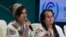 Aya Khourshid, left, speaks next to Jacob Johns as they participate in a panel on Indigenous perspectives at the COP29 U.N. Climate Summit, Monday, Nov. 11, 2024, in Baku, Azerbaijan.