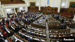 FILE - Lawmakers attend a parliament session in Kyiv, Ukraine, Dec. 21, 2017. 