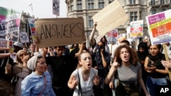 Demonstrators demand justice for the victims of the recent deadly apartment block fire at Grenfell Tower, after marching to Parliament in London, June 21, 2017. The mass "Day of Rage" demonstration is timed to coincide with the state opening of Parliament.