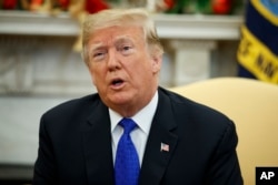 President Donald Trump speaks during a meets with Democratic leaders the Oval Office of the White House, Dec. 11, 2018, in Washington.