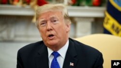 President Donald Trump speaks during a meets with Democratic leaders the Oval Office of the White House, Dec. 11, 2018, in Washington.