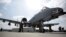 FILE - U.S. military personnel stand beside an A-10C fighter jet at Kandahar Airfield, Afghanistan, Jan. 23, 2018. The U.S. has stepped up airstrikes targeting and destroying Taliban training camps in the northeastern Afghan province of Badakhshan, the U.S. military says.