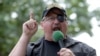 FILE - In this June 25, 2017, photo, Stewart Rhodes, founder of the citizen militia group known as the Oath Keepers, speaks during a rally outside the White House in Washington. 