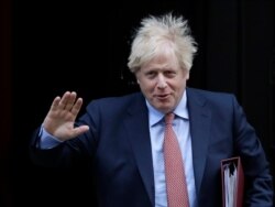 Britain's Prime Minister Boris Johnson leaves 10 Downing Street to attend the weekly session of Prime Ministers Questions in Parliament in London, Jan. 29, 2020.