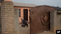 A pram stands outside the home of Gosiame Thamara Sithole in Tembisa, near Johannesburg, Thursday, June 10, 2021.