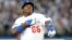 El cubano Yasiel Puig reacciona luego de conectar un triple en la cuarta entrada en el tercer juego de la serie contra los Cardenales de San Luis.