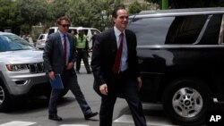 FILE - In this Jan. 15, 2020 photo, President Donald Trump's Latin America adviser Mauricio Claver-Carone right, arrives in La Paz, Bolivia. The Trump administration said that it plans to nominate Claver-Carone to lead the Inter-American Development Ban