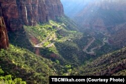 Hikers near the end of the Canyon Overlook Trail at Zion National Park in Utah are rewarded with stunning views of the massive sandstone bluffs and the sweeping landscape below.