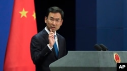 FILE - Chinese Foreign Ministry spokesman Geng Shuang speaks during a daily briefing at ministry offices in Beijing, Sept. 4, 2017. The ministry's website on Sept. 22, 2018, called U.S. imposition of sanctions in response to China's purchase of military equipment from Russia "a serious violation of the basic principles of international law" and a "hegemonic act."