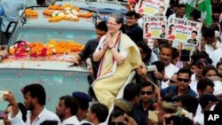 Congress party leader Sonia Gandhi greets supporters at the outset of a road show ahead of upcoming Uttar Pradesh state assembly elections, in Varanasi, India, Aug. 2, 2016. 