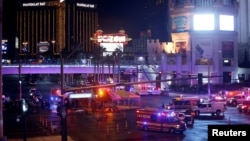  Las Vegas Metro Police and medical workers stage in the intersection of Tropicana Avenue and Las Vegas Boulevard South after a mass shooting at a music festival on the Las Vegas Strip in Las Vegas, Nevada, Oct. 1, 2017. 