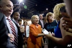 Democratic presidential candidate Hillary Clinton greets members of the audience after speaking at a rally at Osceola Heritage Park, in Kissimmee, Fla.,Aug. 8, 2016.