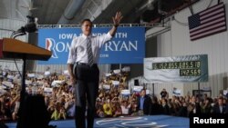 Republican presidential nominee Mitt Romney takes the stage at a campaign rally in Cedar Rapids, Iowa October 24, 2012.