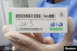 A nurse holds a box of COVID-19 vaccines made by the Beijing Institute of Biological Products, a unit of Sinopharm's subsidiary China National Biotec Group (CNBG).  (Photo: Reuters)