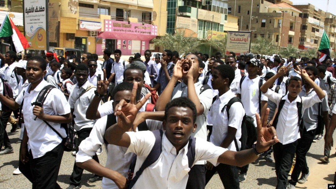 Sudanese students protest in the capital Khartoum, July 30, 2019, a day after teenagers were shot at a rally against shortages of bread and fuel in the town of al-Obeid, about 420 kilometers southwest of the capital.