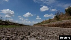 FILE - A dried-up creek bed is seen in a drought-affected area near Chivilcoy, Argentina February 28, 2018.