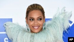 FILE - Beyonce Knowles arrives at the MTV Video Music Awards at Madison Square Garden, in New York, Aug. 28, 2016. The singer and UNICEF are joining forces to provide clean, safe water to children in Burundi.