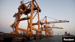FILE - Cranes, damaged by airstrikes, are seen at the container terminal of the Red Sea port of Hodeidah, Yemen, Nov. 26, 2017. 