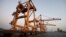 FILE - Cranes, damaged by airstrikes, are seen at the container terminal of the Red Sea port of Hodeidah, Yemen, Nov. 26, 2017. 