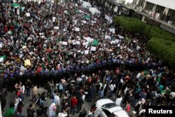 Students take part in a protest to denounce an offer by President Abdelaziz Bouteflika to run in elections next month but not to serve a full term if re-elected, in Algiers, Algeria, March 5, 2019.
